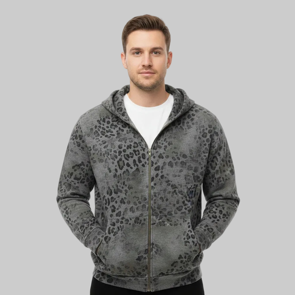 A man wearing a gray zip-up hoodie with a black leopard print pattern over a white t-shirt, photographed against a solid white background.